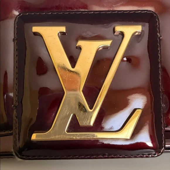 Louis Vuitton Burgundy Sobe clutch with Brass Hardware